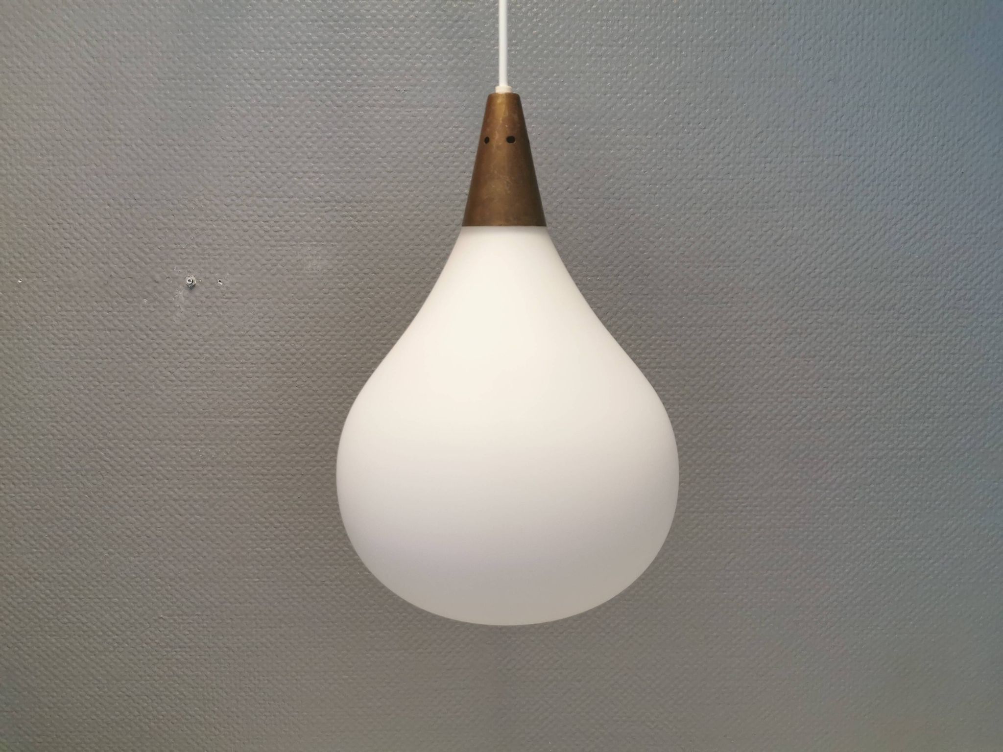 Large hanging lamp in white opal glass with brass top. Danish and estimated from the 1970s.