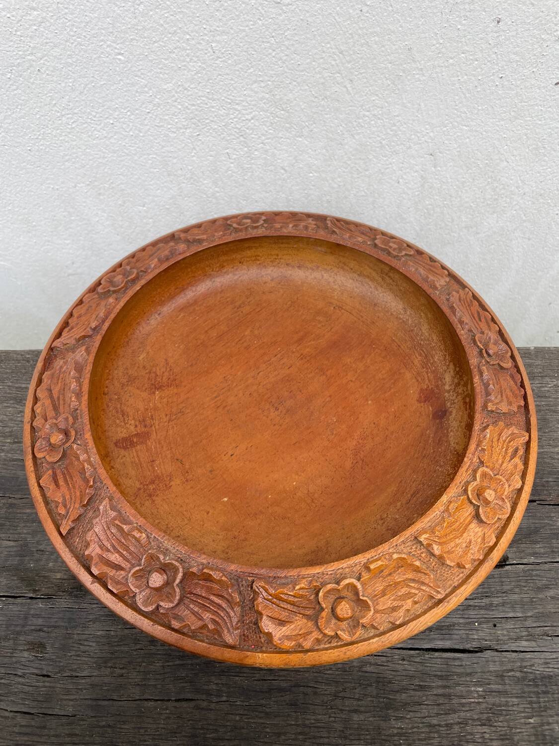 Carved wooden pocket emptier