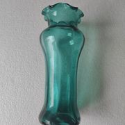 Blown glass vase with a flared neck and wavy rim.
