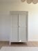 Large Parisian wardrobe in renovated oak wood.