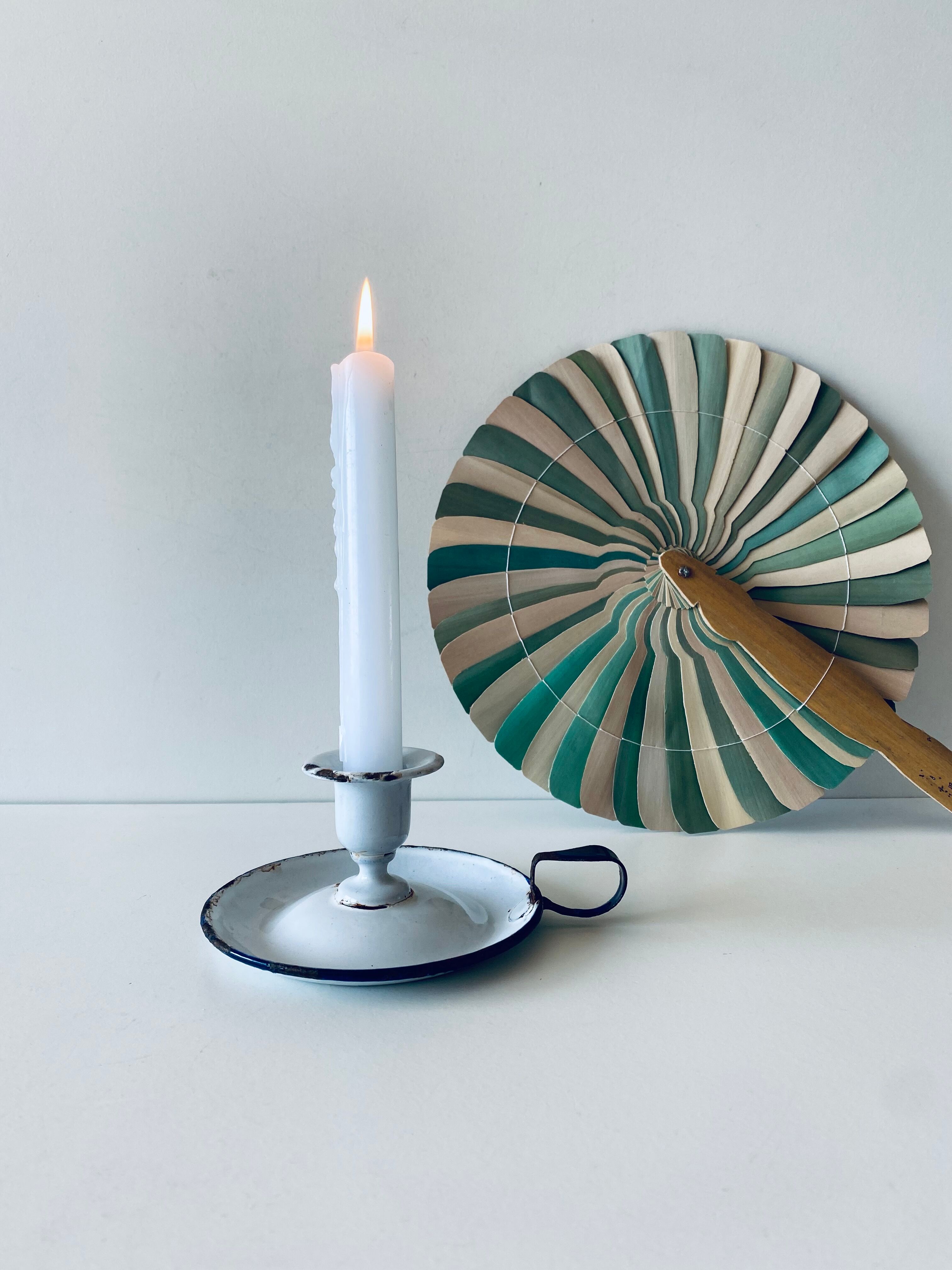 Antique candle holder in white and blue enamelled metal