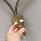 Older wall lamp with black metal shades and brass bend ‘arms’