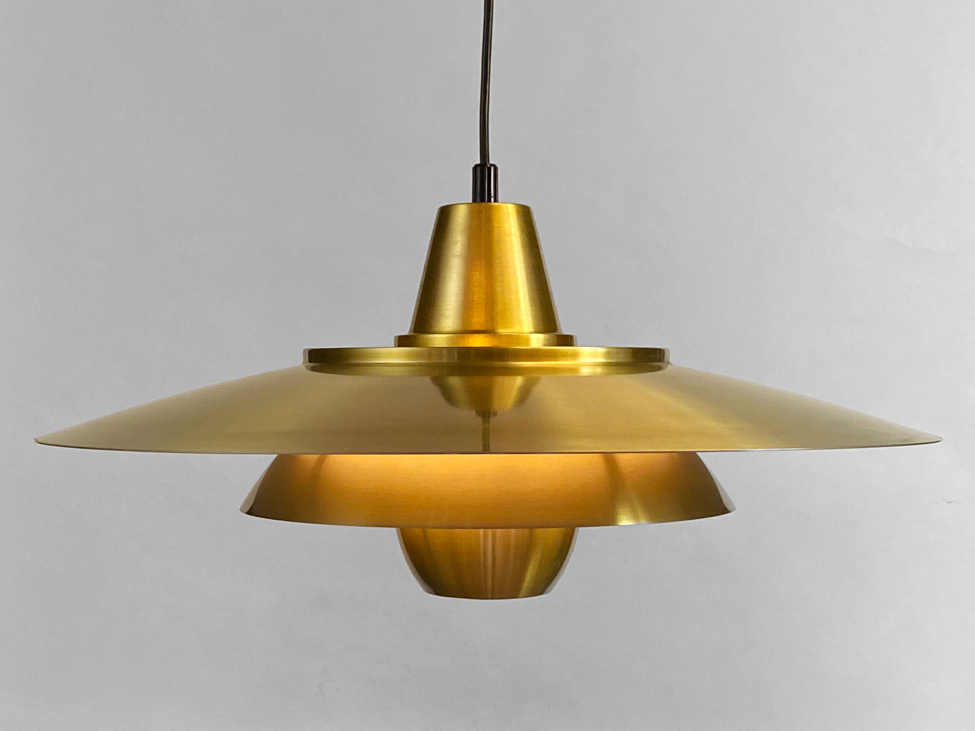 Large brushed aluminum pendant light with golden finish. Produced by Jeka. Denmark 1970s