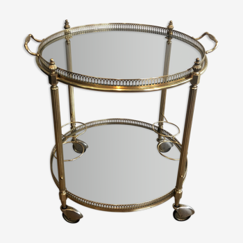 Neoclassical style rolling table in brass