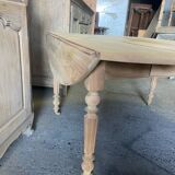 Oval wooden table on wheels.