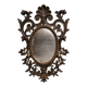 Antique Louis XV style mirror, richly carved with decorations of scrolls, shells, and foliage.