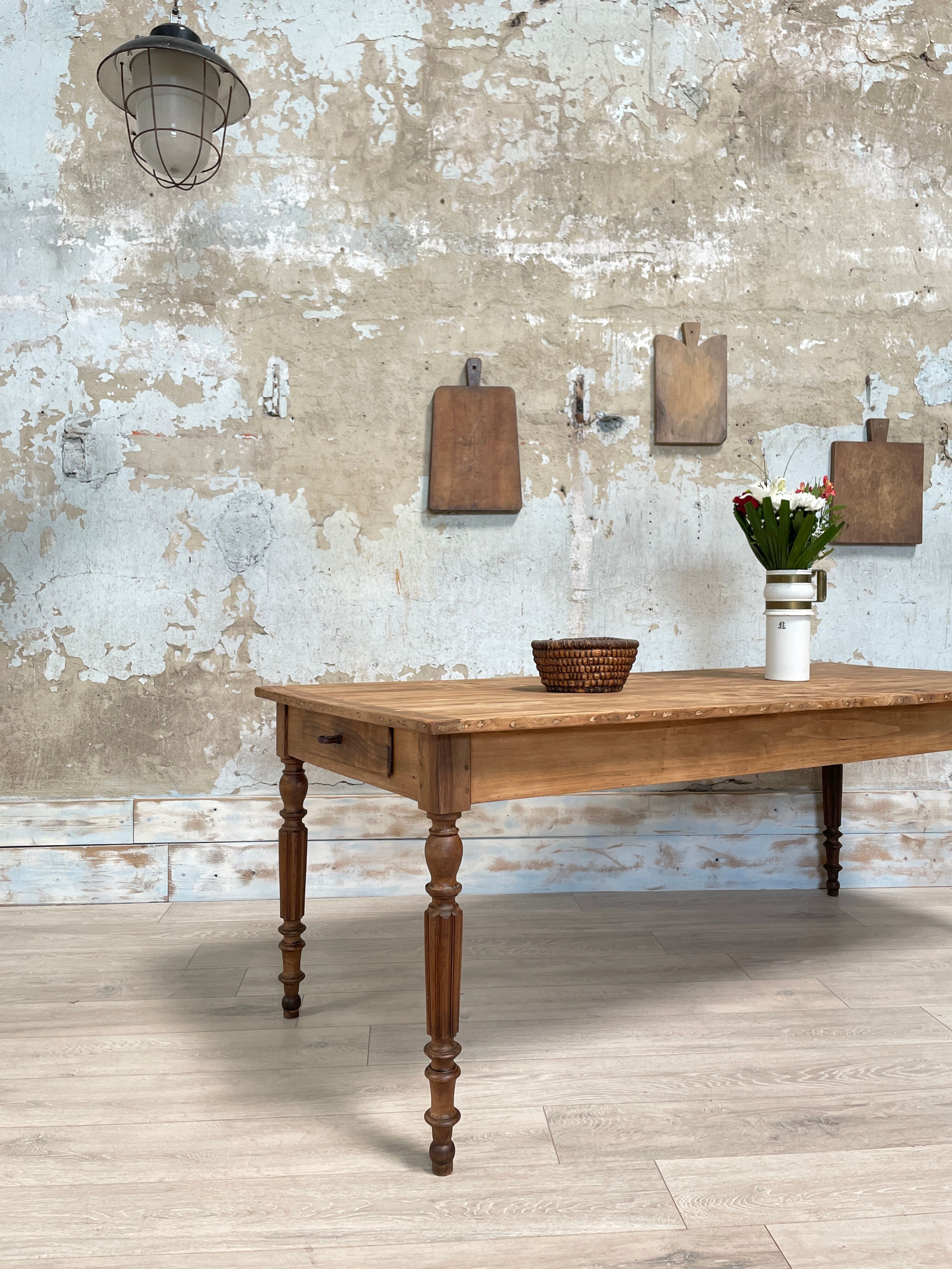 Vintage farmhouse table with turned legs.