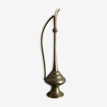 Decorative decanter in brass