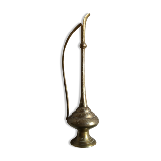 Decorative decanter in brass