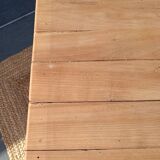 Low farmhouse table in raw wood