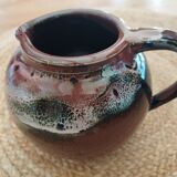 Stoneware pitcher by Matthieu Liévois in shades of red