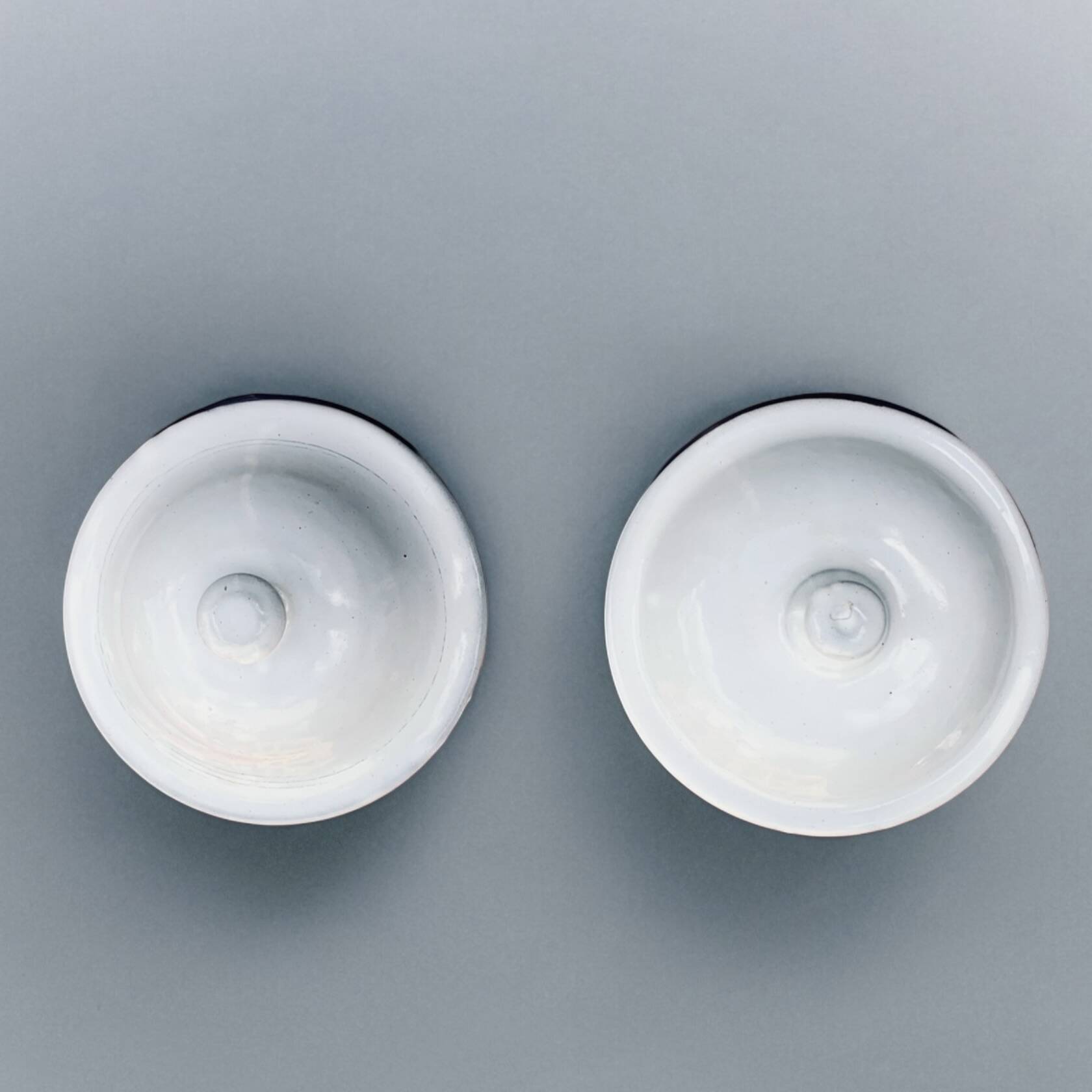 Pair of old large enameled sheet metal condiment pots