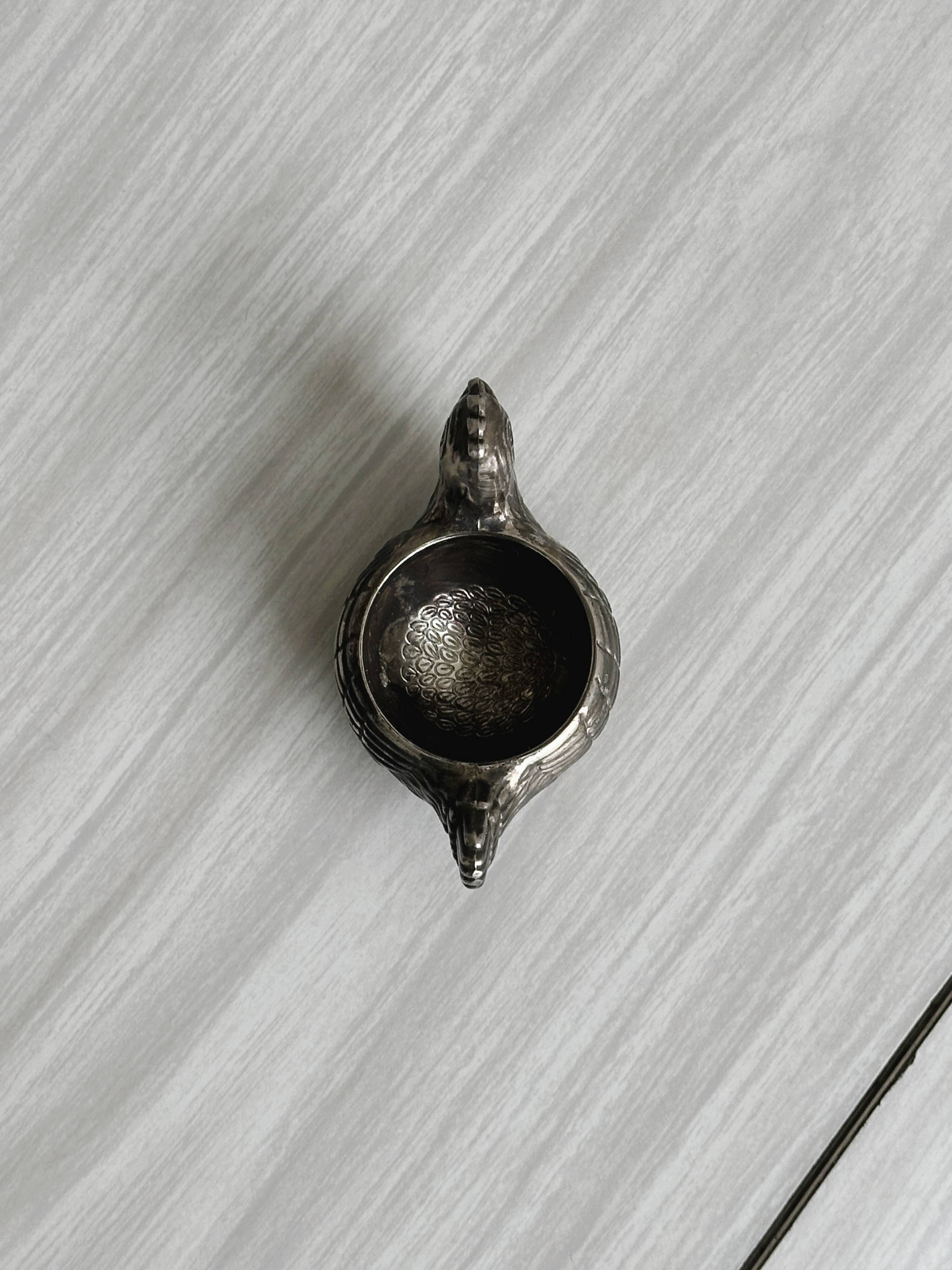 Antique egg cup in the shape of a hen