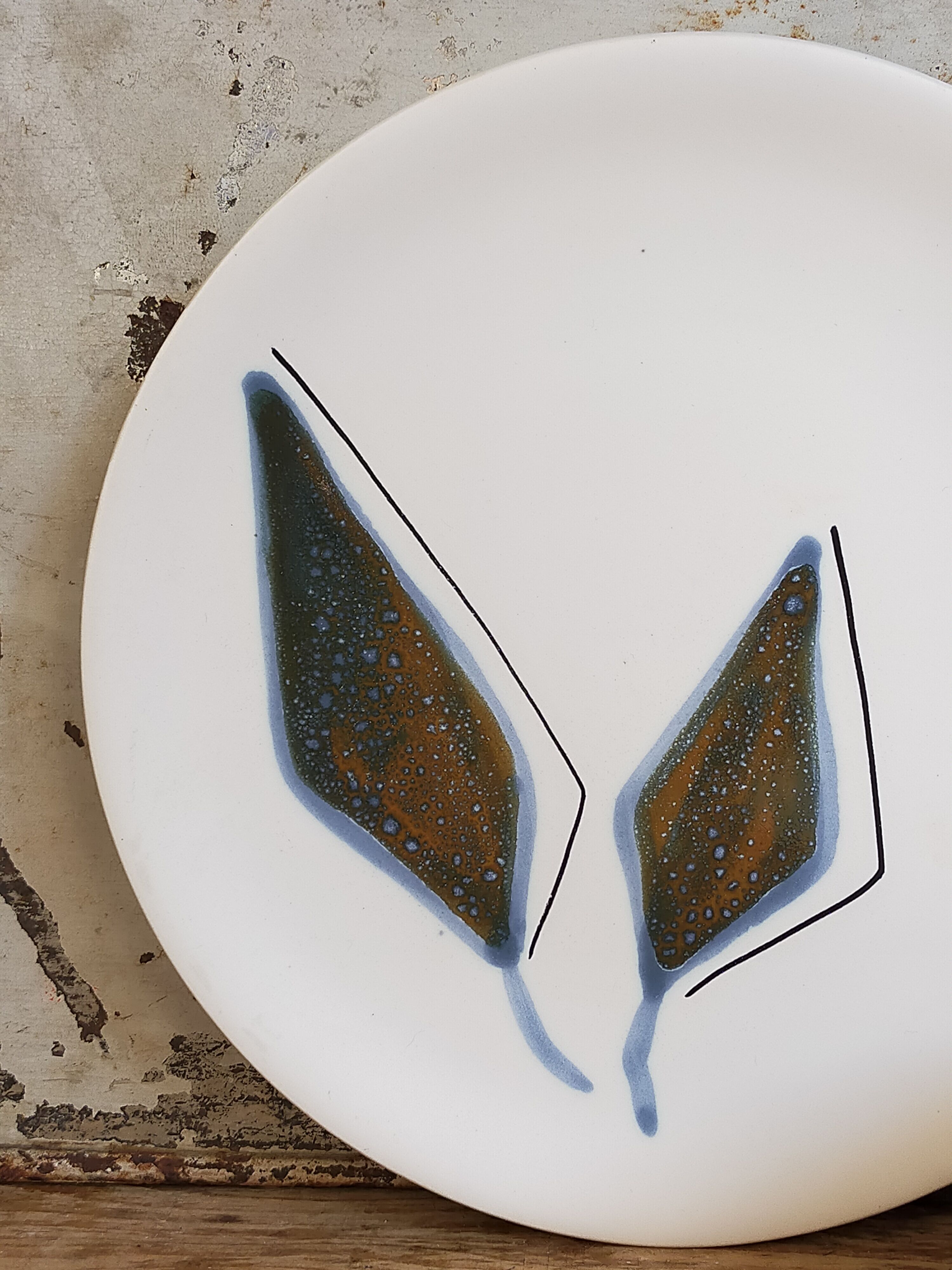 Six ceramic plates with matt enamel 50s