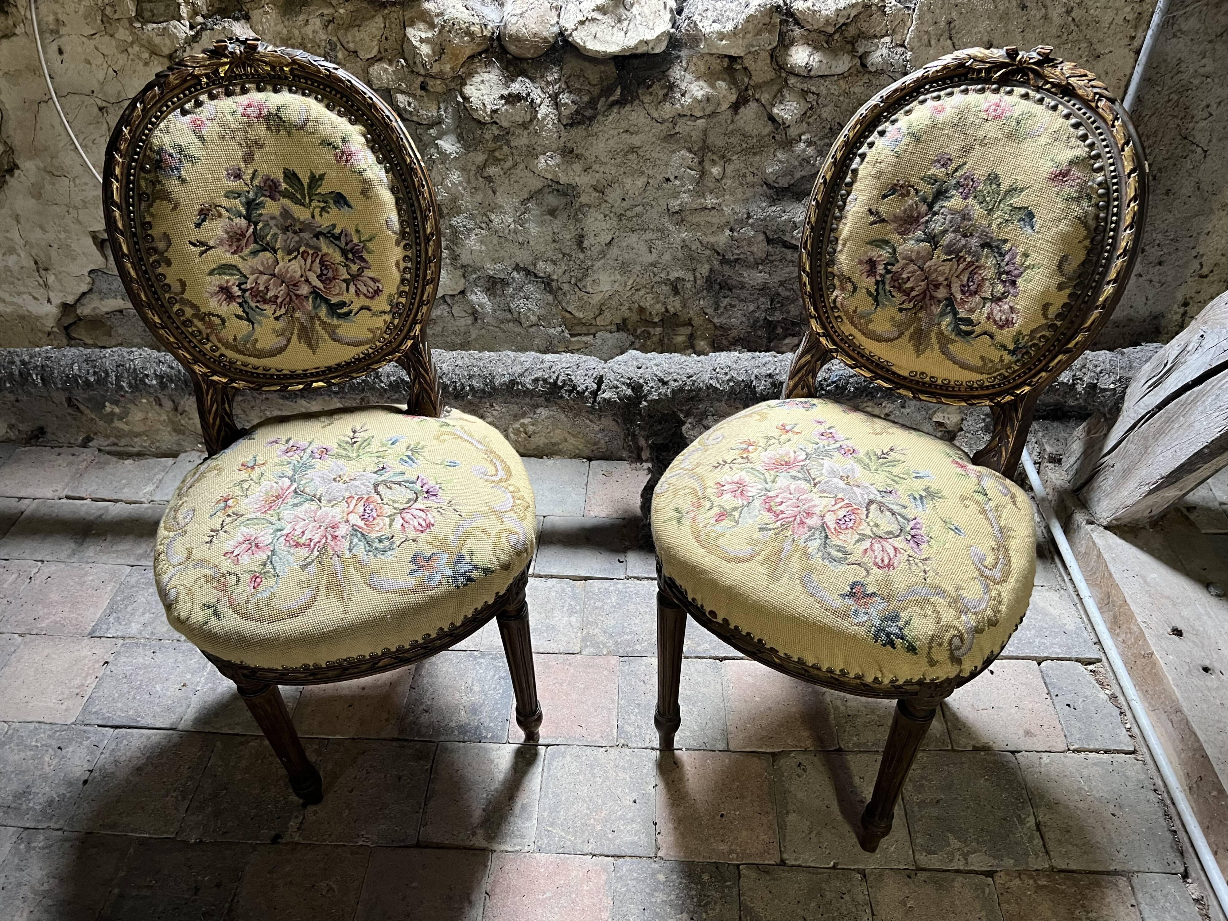 pretty pair of Louis XVI style chairs, in carved and gilded wood