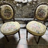 pretty pair of Louis XVI style chairs, in carved and gilded wood