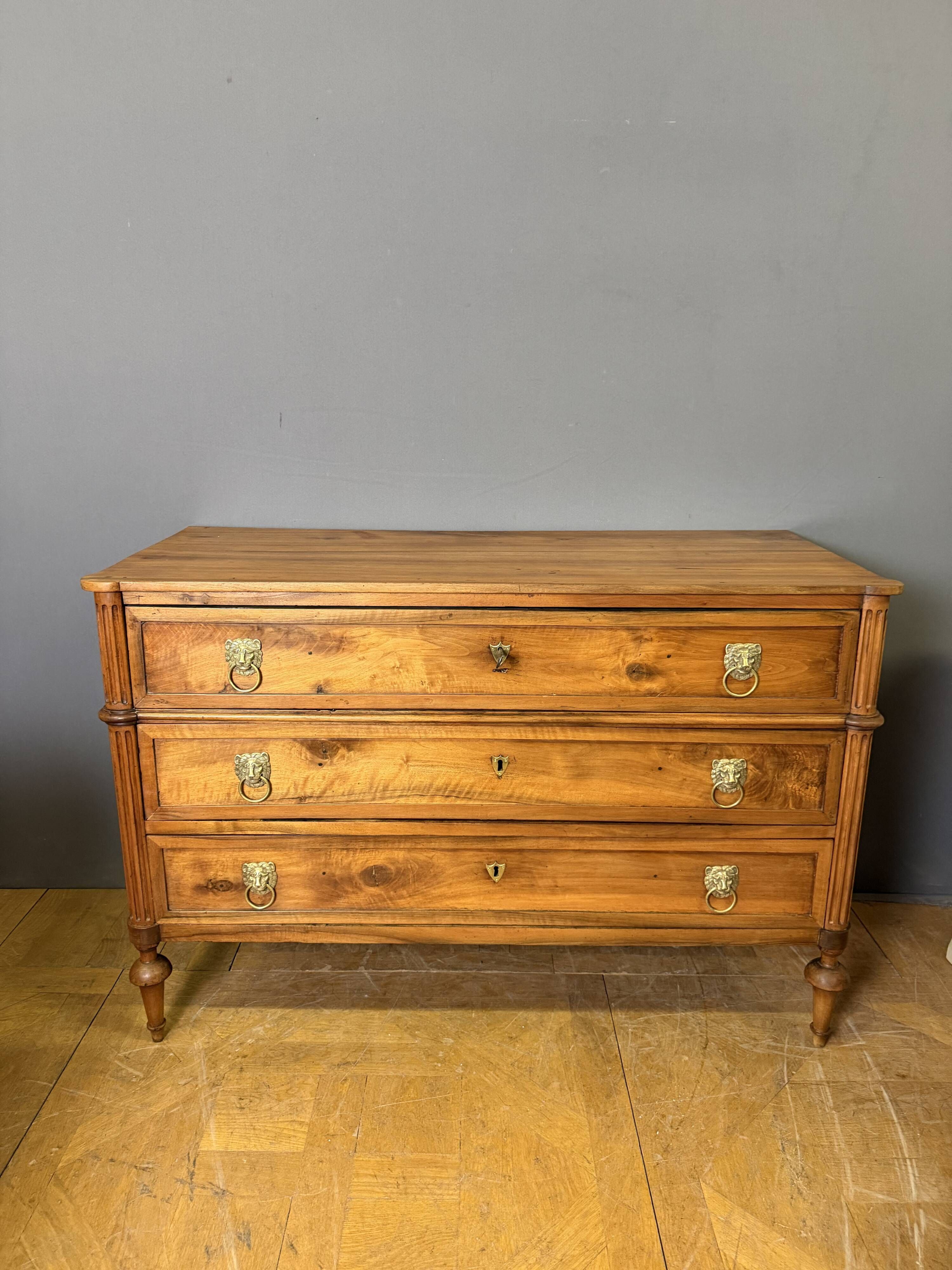 Louis XVI period commode in light walnut.