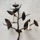 Wall lamp in wrought iron.