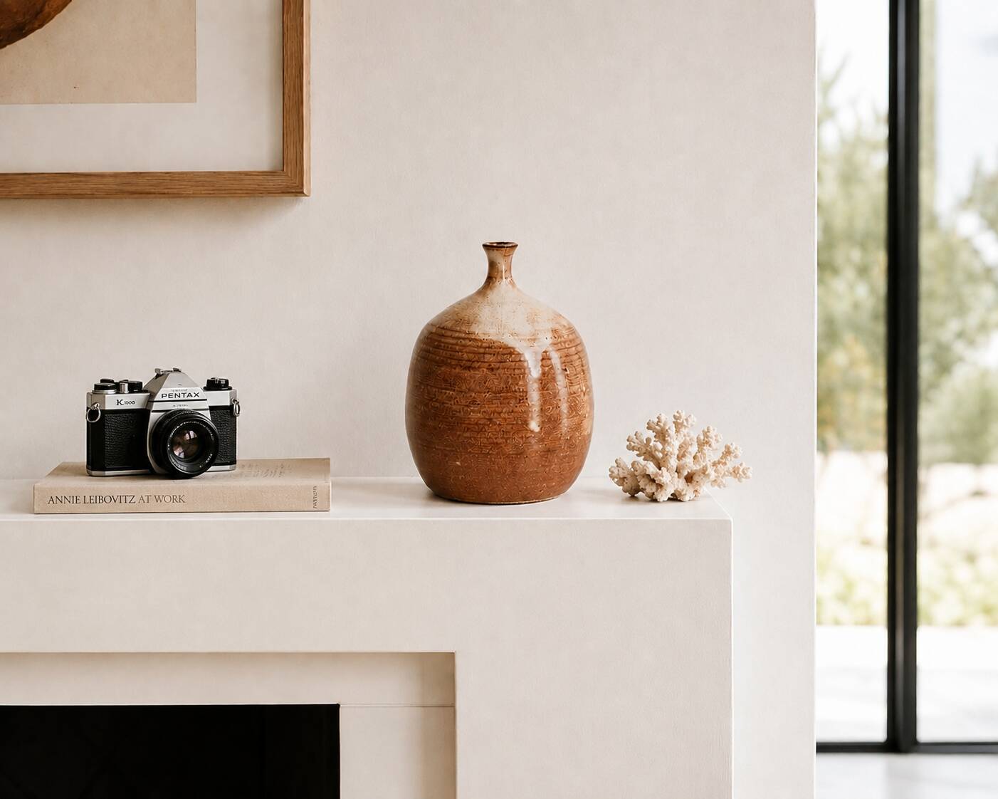 Ovoid vase with a small neck in brown beige ceramic and white drips.