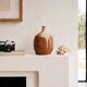 Ovoid vase with a small neck in brown beige ceramic and white drips.