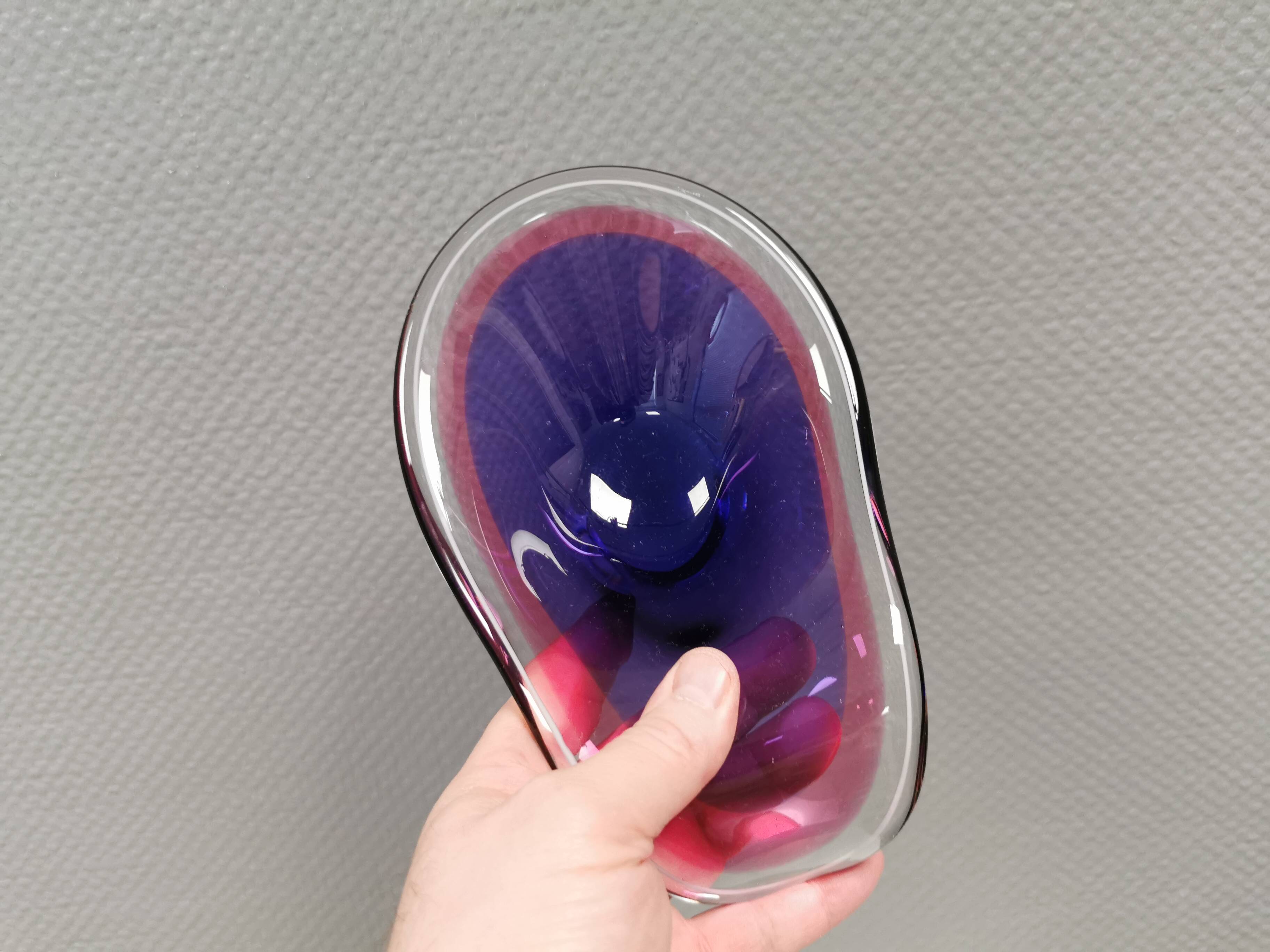 Beautiful dish/bowl in many coloured glass.