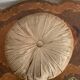 Gold lamé round velvet cushion