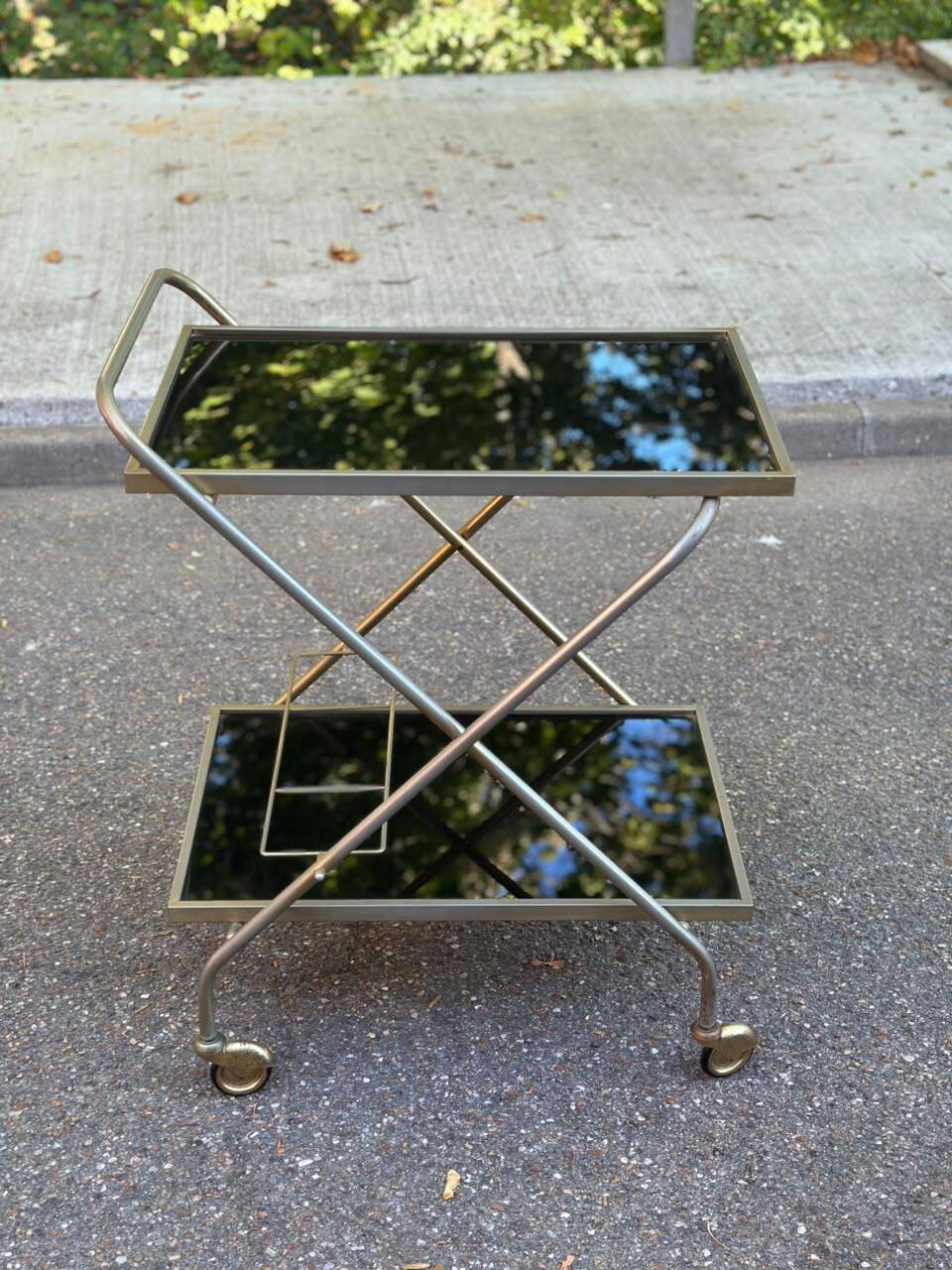 Mid-Century 1978 brass and black smoked glass wheeled dessert trolley.