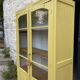 Antique yellow display cabinet