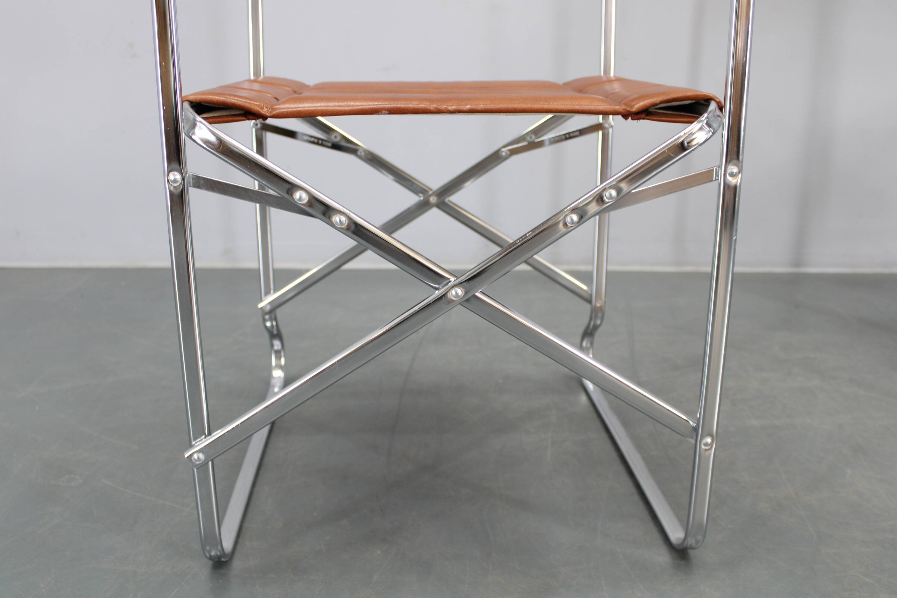 1970s pair of Italian folding chairs with leatherette upholstery