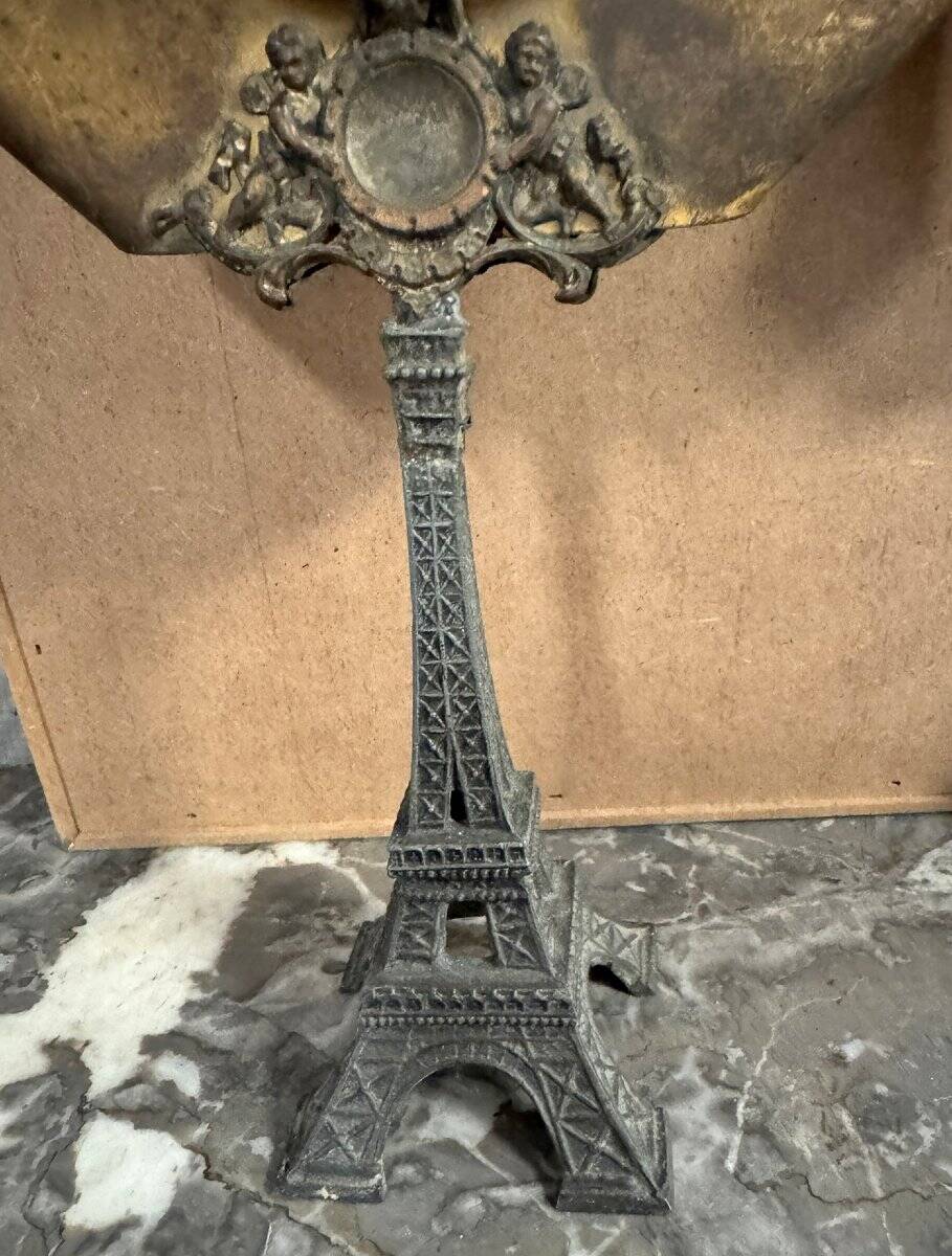 Pair of brass mirrors from the Art Deco period perched on the Eiffel Tower.