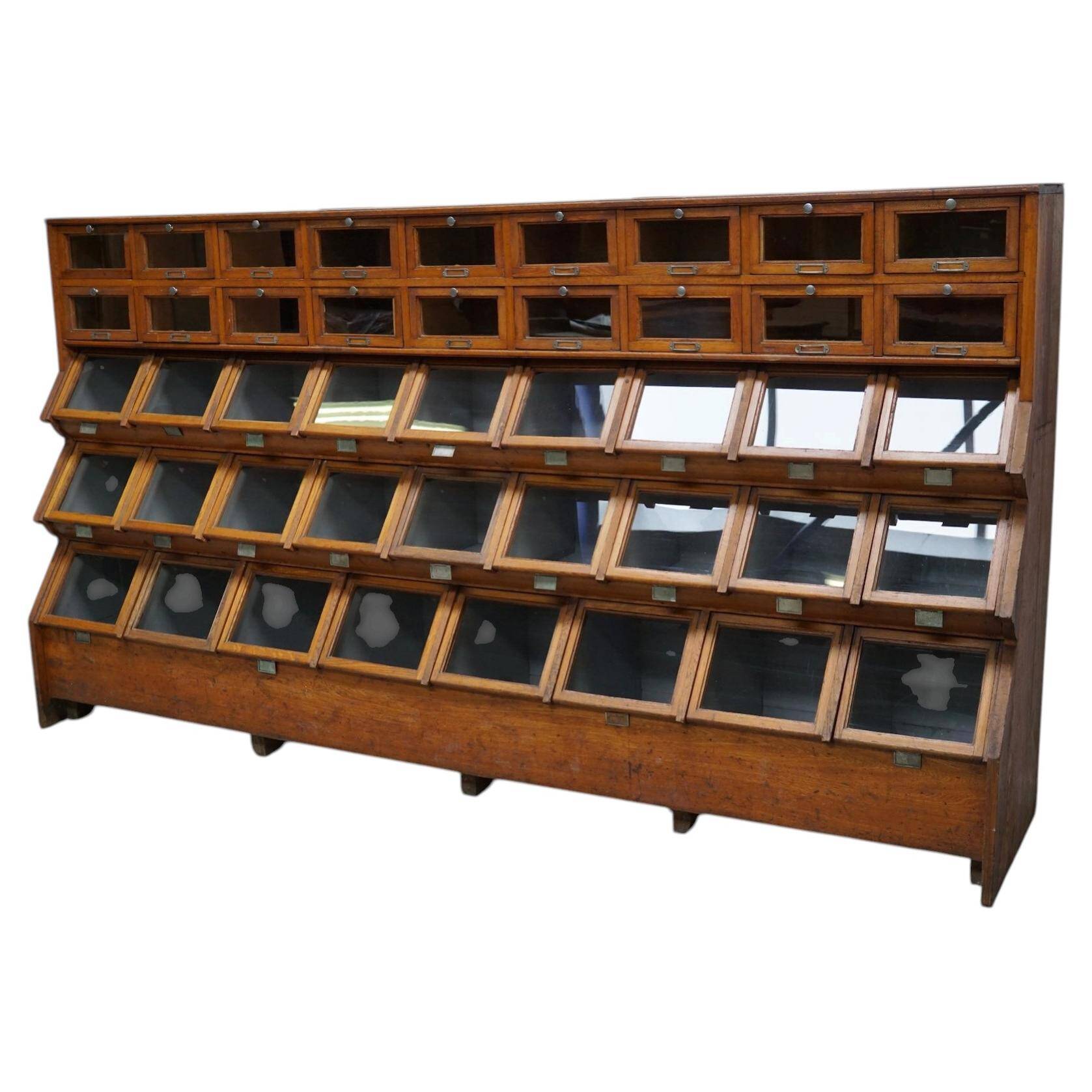 Very large Dutch oak showcase for grocery or haberdashery, 1920s-1930s