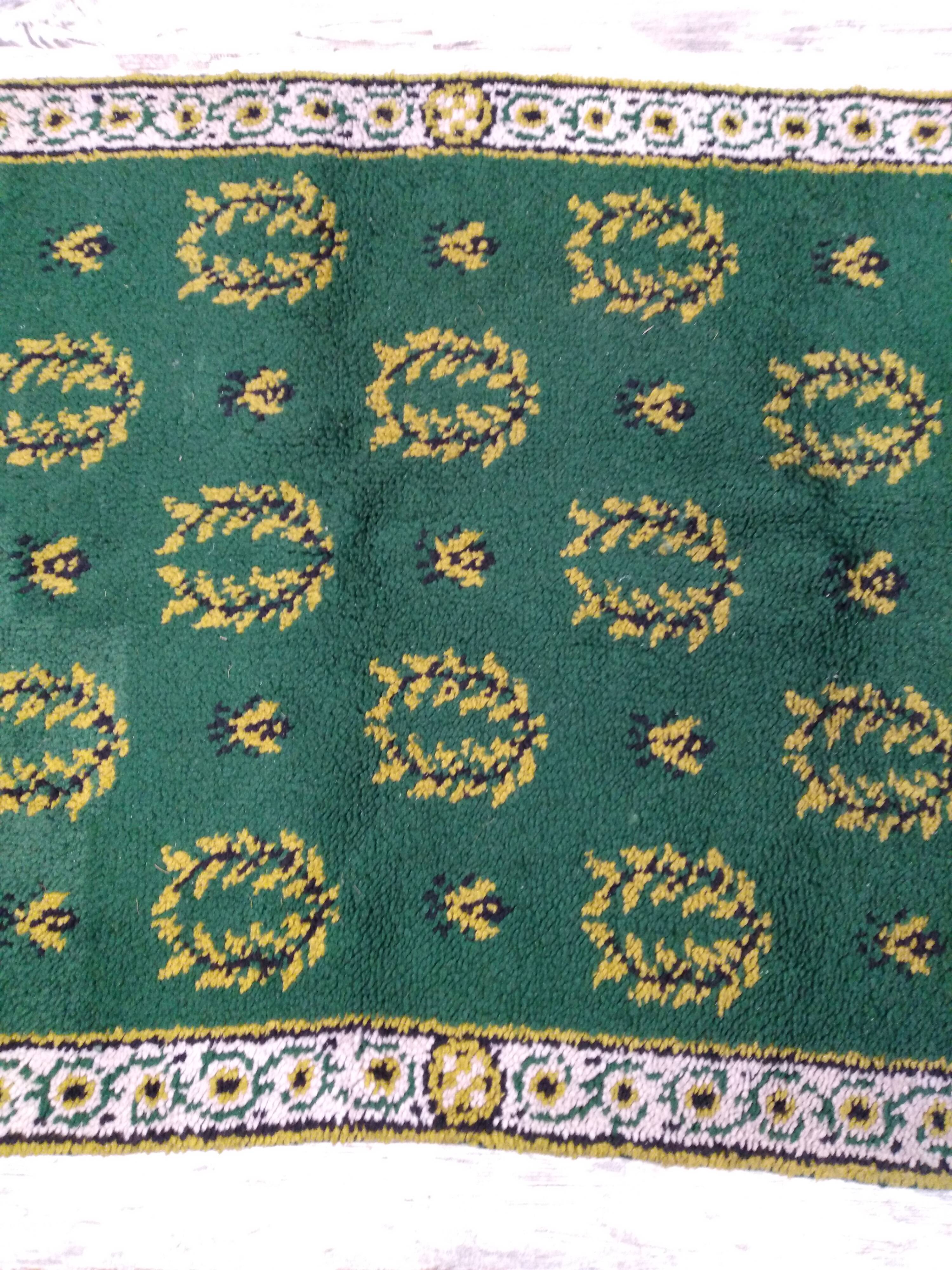 Antique green Berber rug
