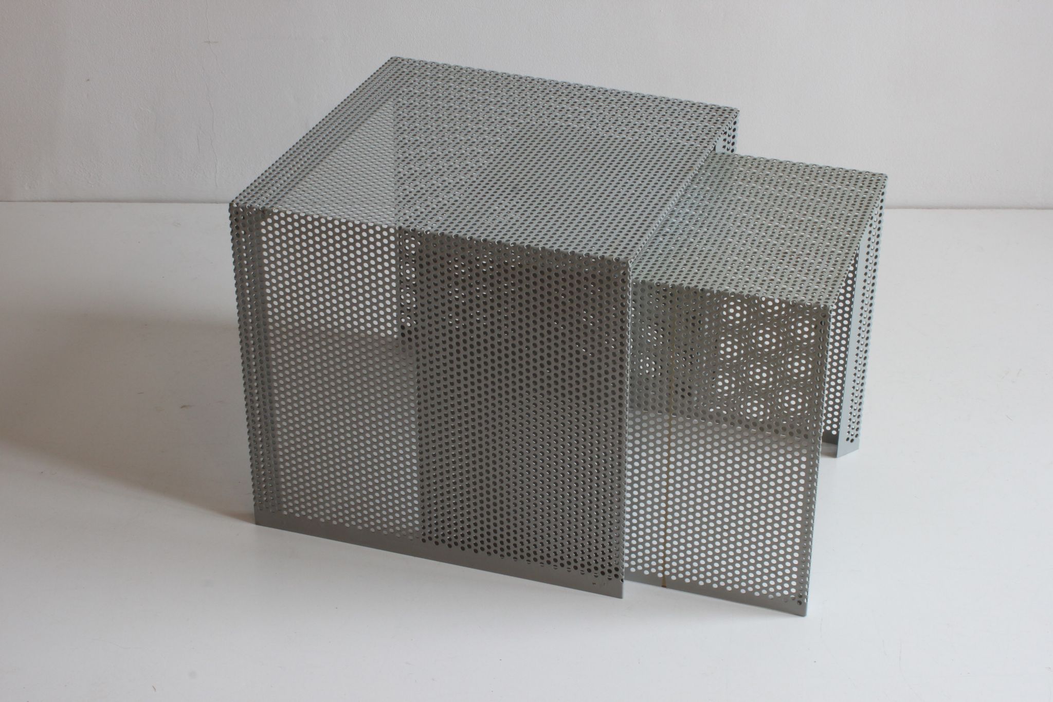 Grey perforated metal nesting side tables, 1990s set of two.