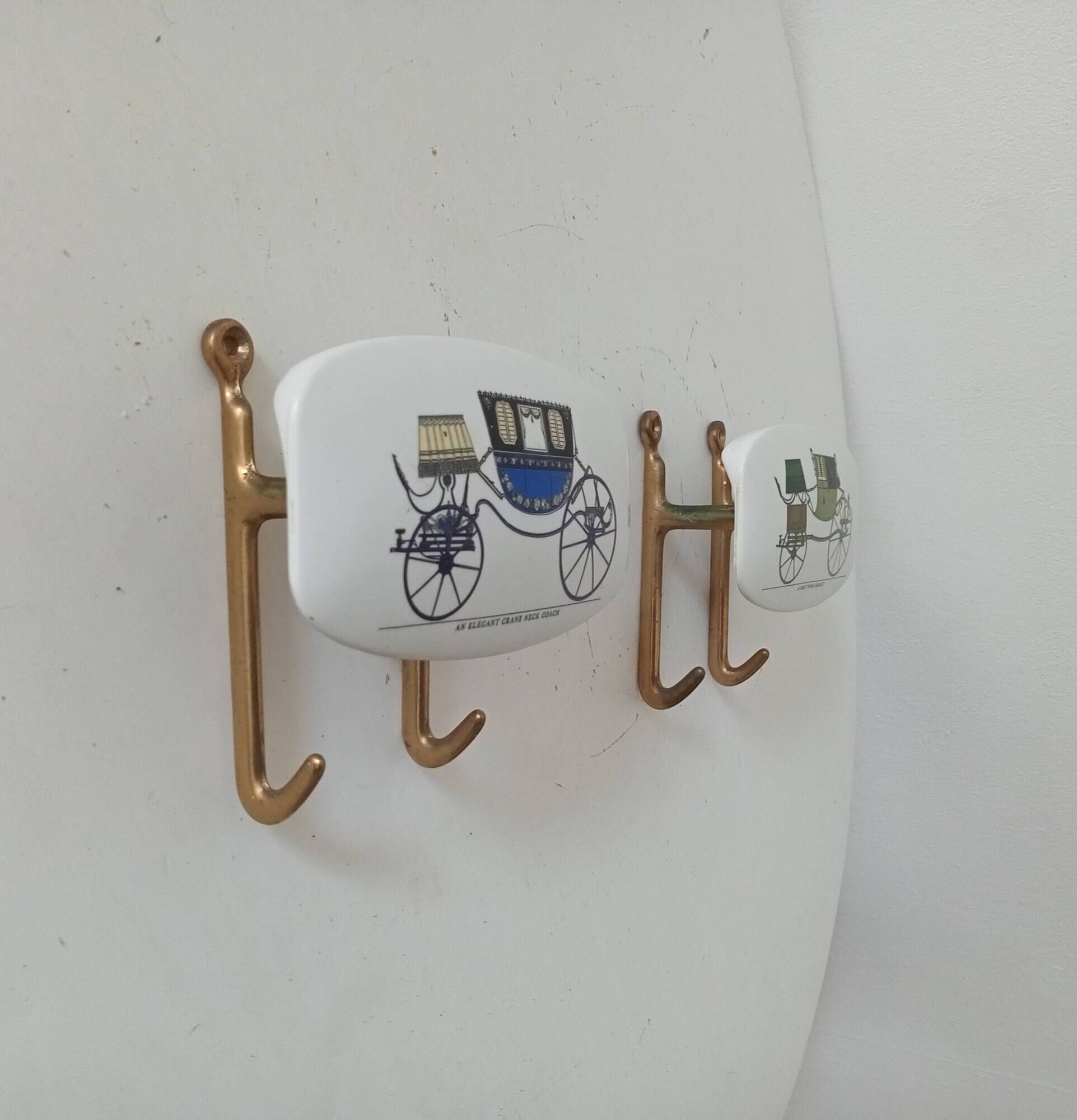 Set of 2 wall coat hooks in Bakelite and brass from the 1950s/60s.
