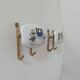 Set of 2 wall coat hooks in Bakelite and brass from the 1950s/60s.