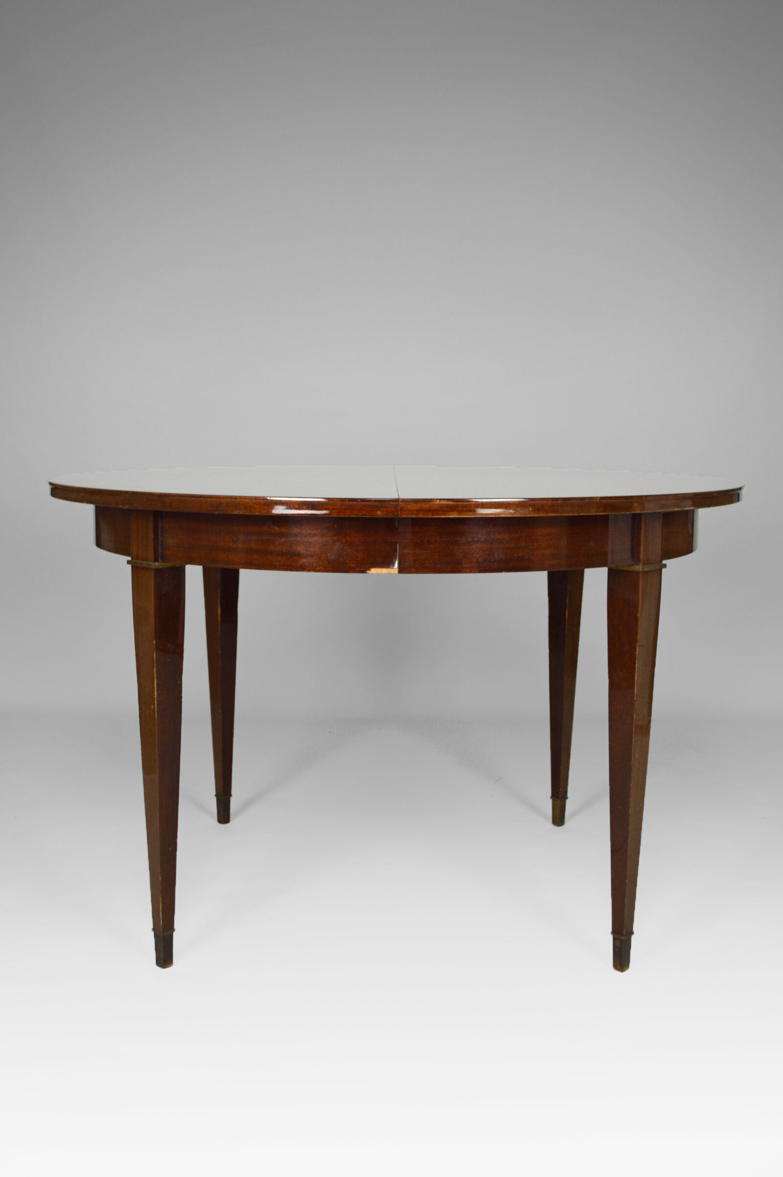 Art Deco mahogany round table by Jacques Adnet around 1940