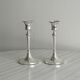 Pair of white metal candlesticks