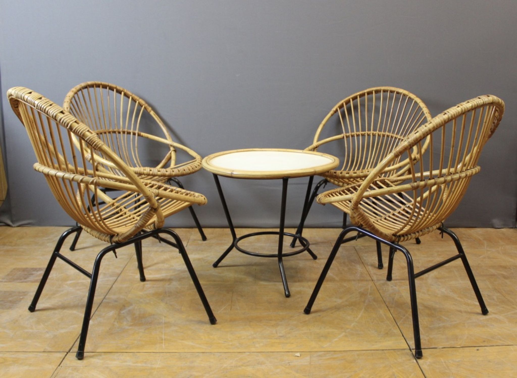 Living room in rattan and black lacquered iron by Rohe Noordwole circa 1950