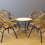 Living room in rattan and black lacquered iron by Rohe Noordwole circa 1950