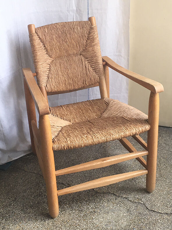 "Paillé" armchair by Charlotte Perriand