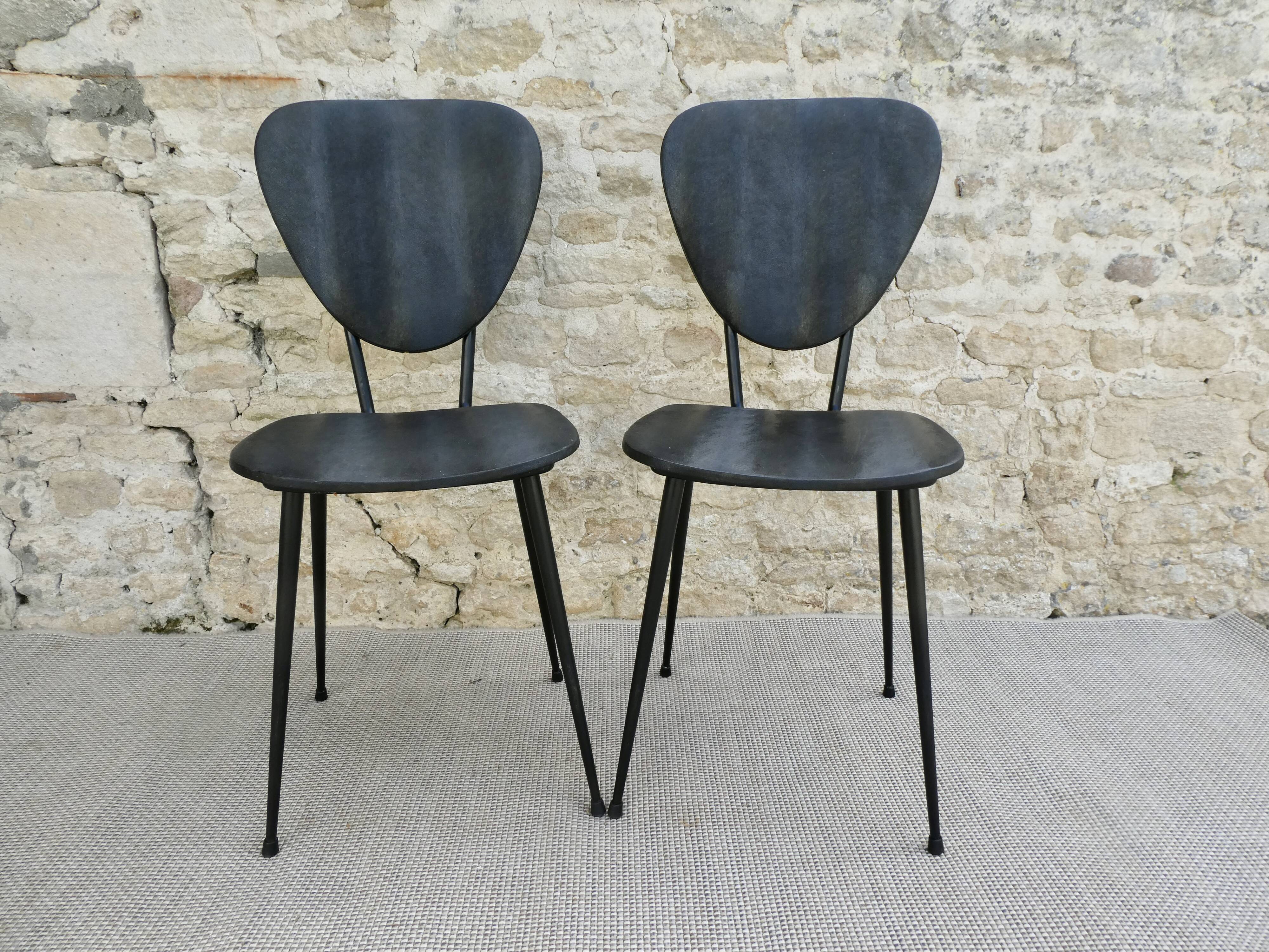 Pair of chairs with tapered metal legs and black Skaï, 60s