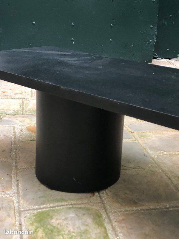 Rectangular coffee table in stained black wood with ball and cylindrical legs.