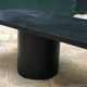 Rectangular coffee table in stained black wood with ball and cylindrical legs.