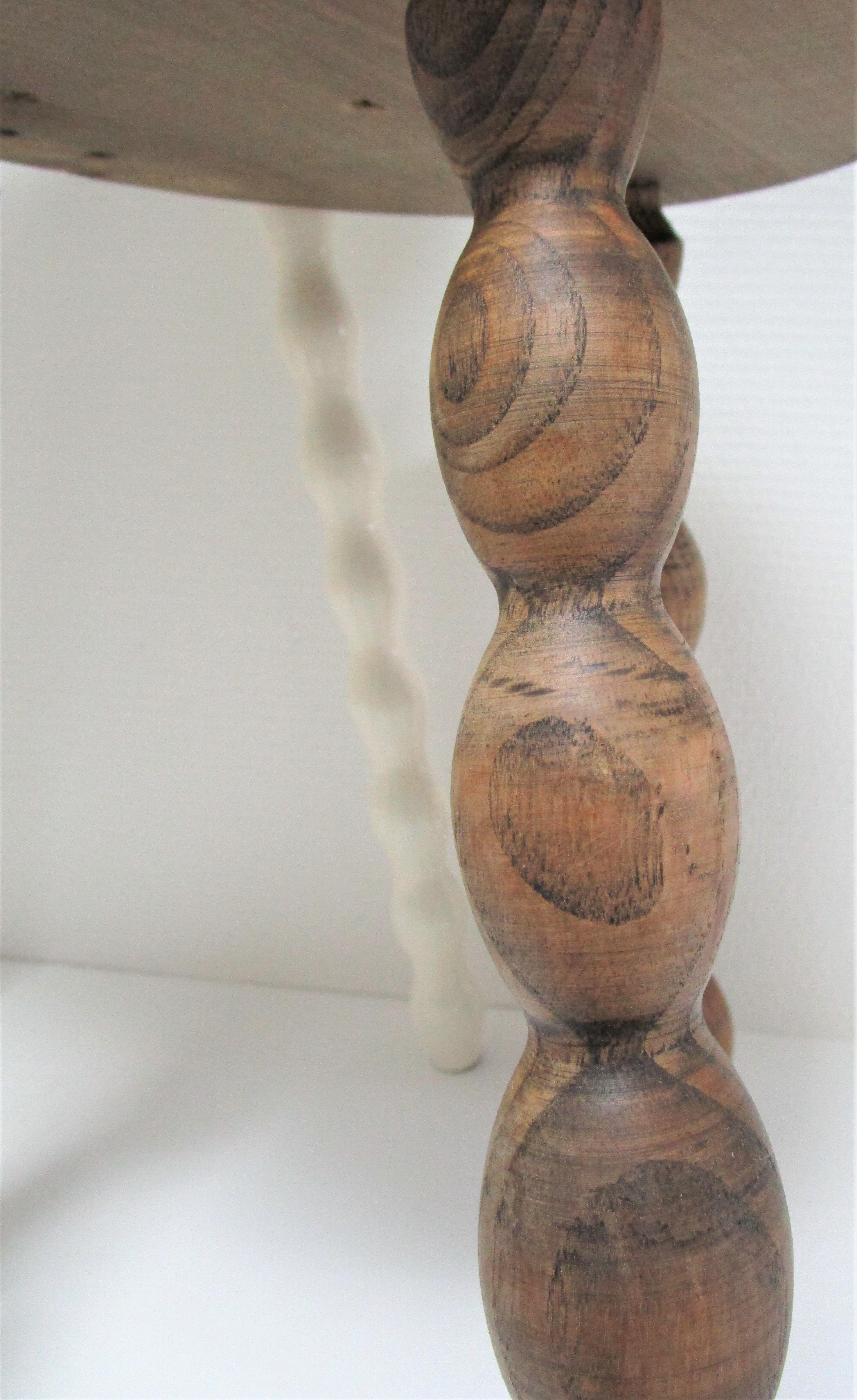 Two vintage tripod solid wood stools