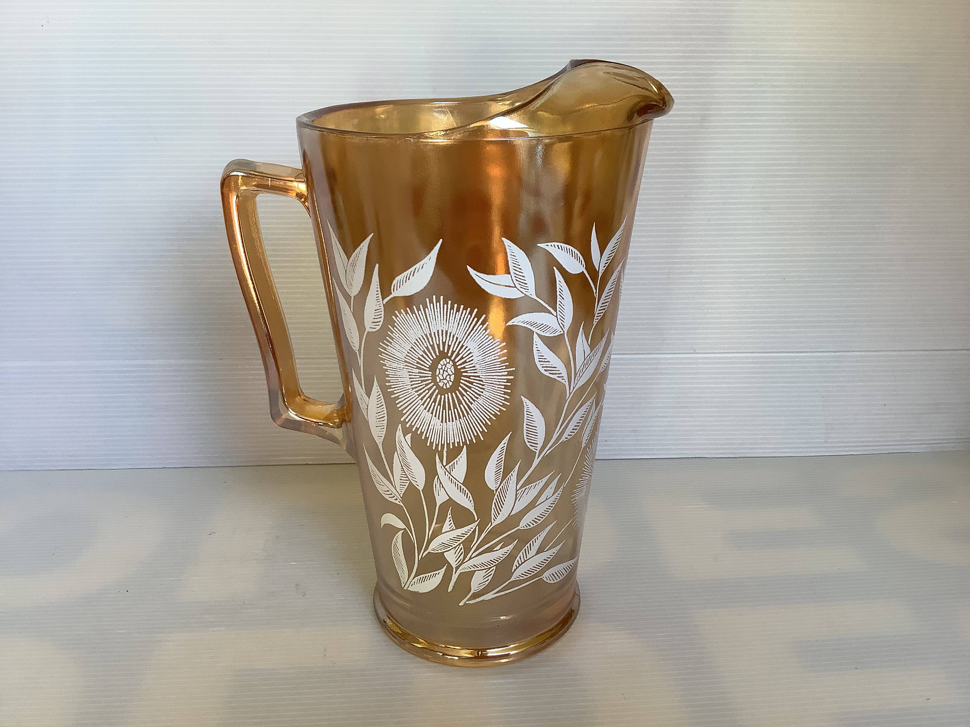 Service of marigold lemonade with iridescent reflections.