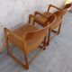 Pair of Baumann armchairs model sled