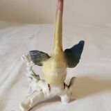 Polychrome porcelain parakeet figurine by Karl Ens.