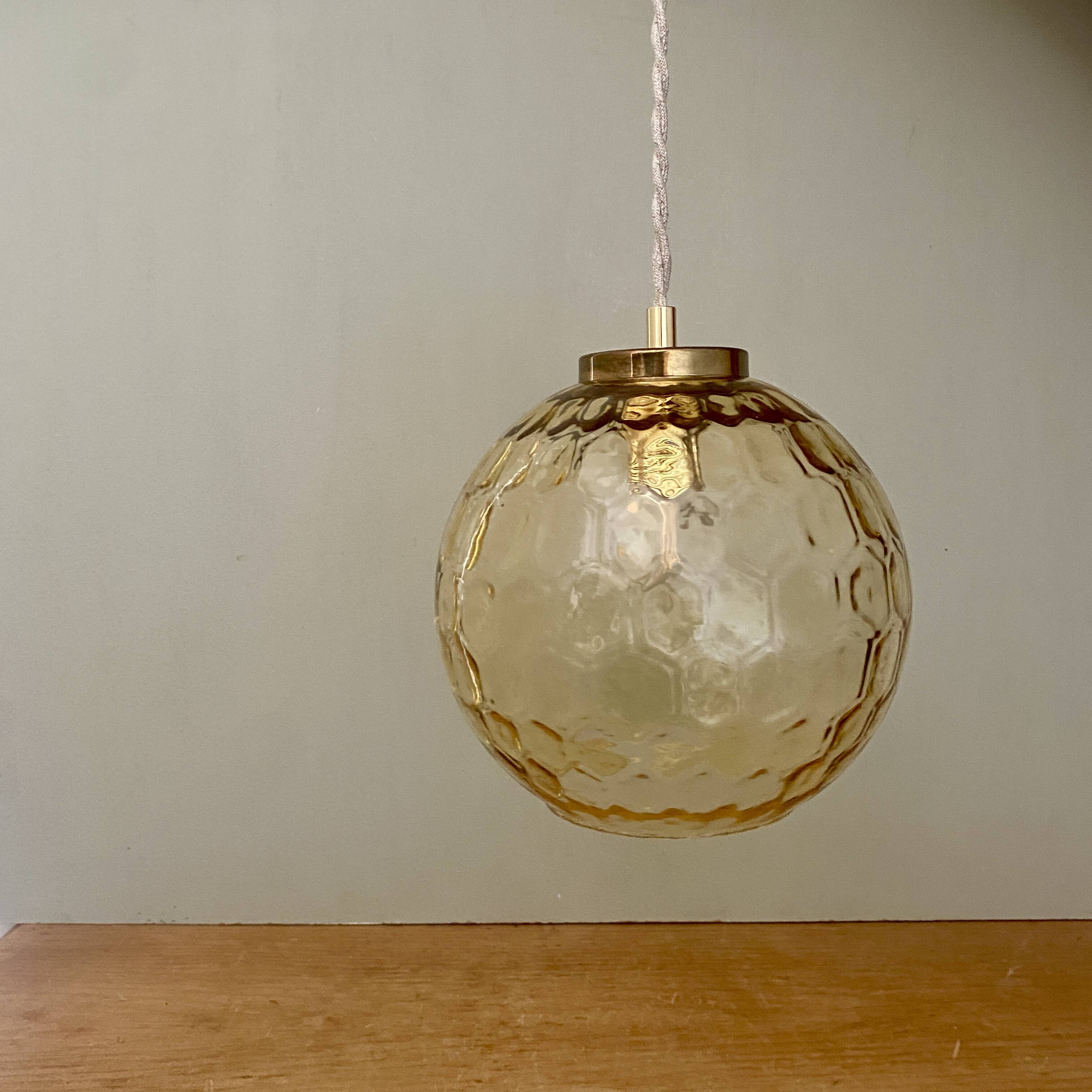 Vintage globe pendant light in amber glass