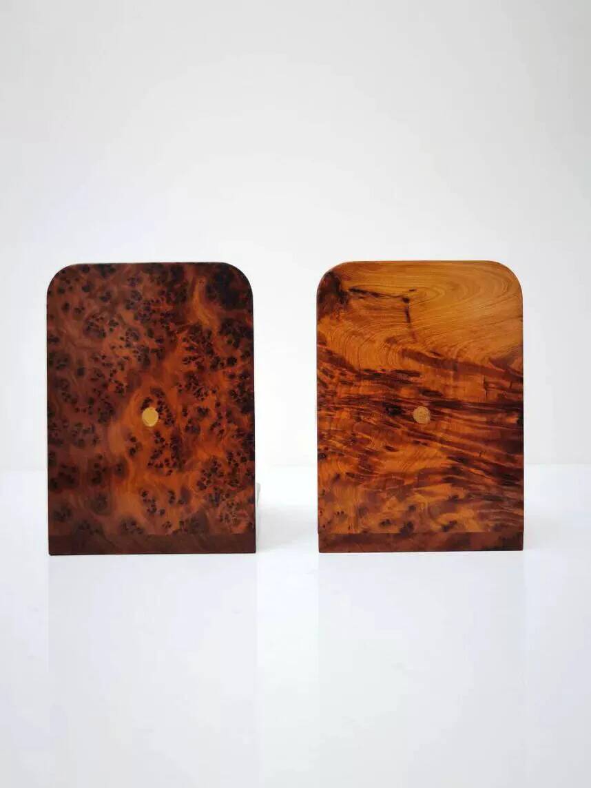 Art Deco bookends made of polished solid burl wood.