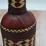Set of 2 decorative vintage bottles covered with leather & wicker